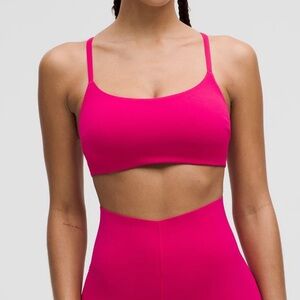 Lululemon Wunder Train Strappy Racer Bra C/D Size 4 in the color Passionate